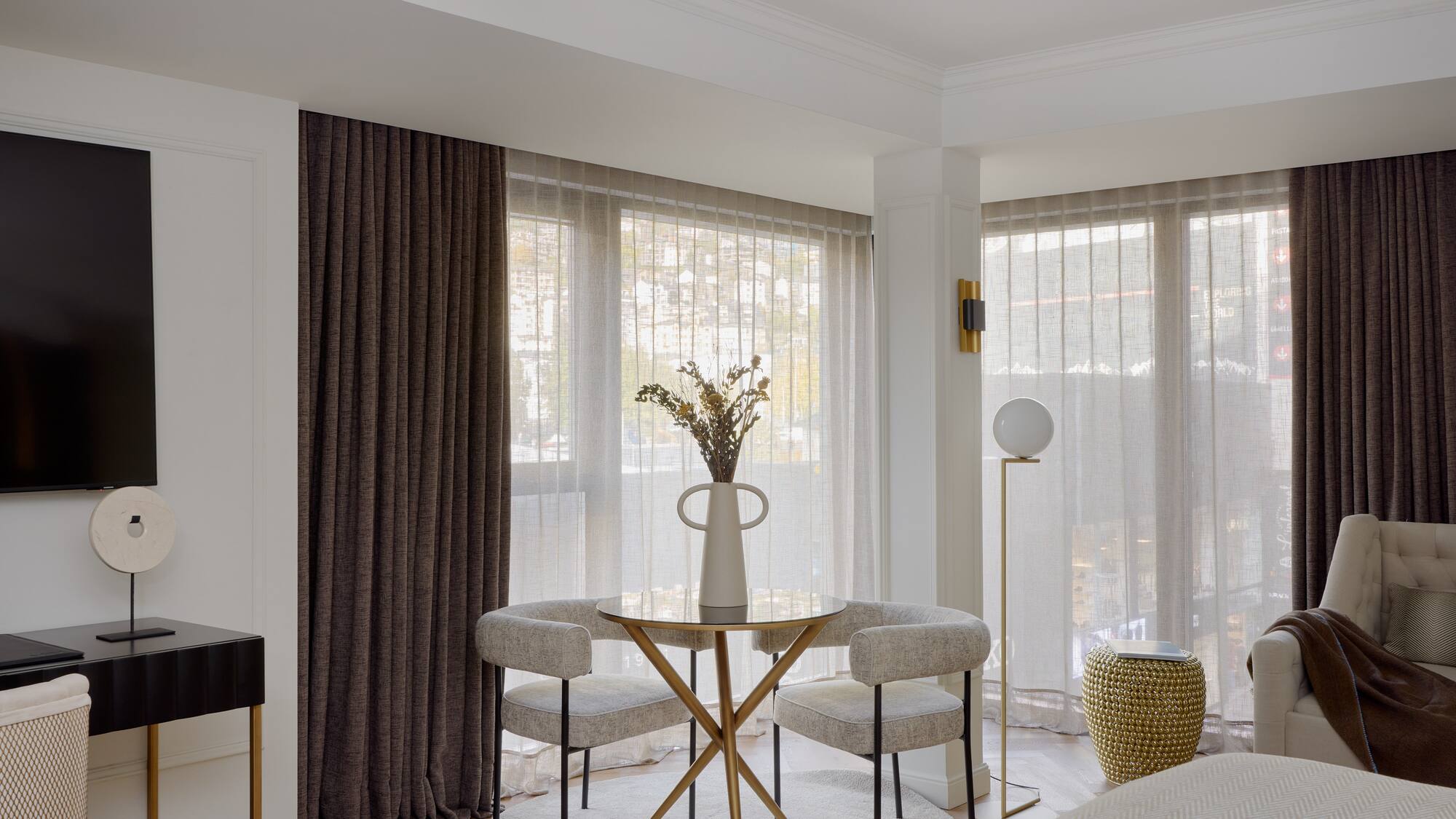 a room with a table and chairs