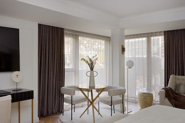 a room with a table and chairs