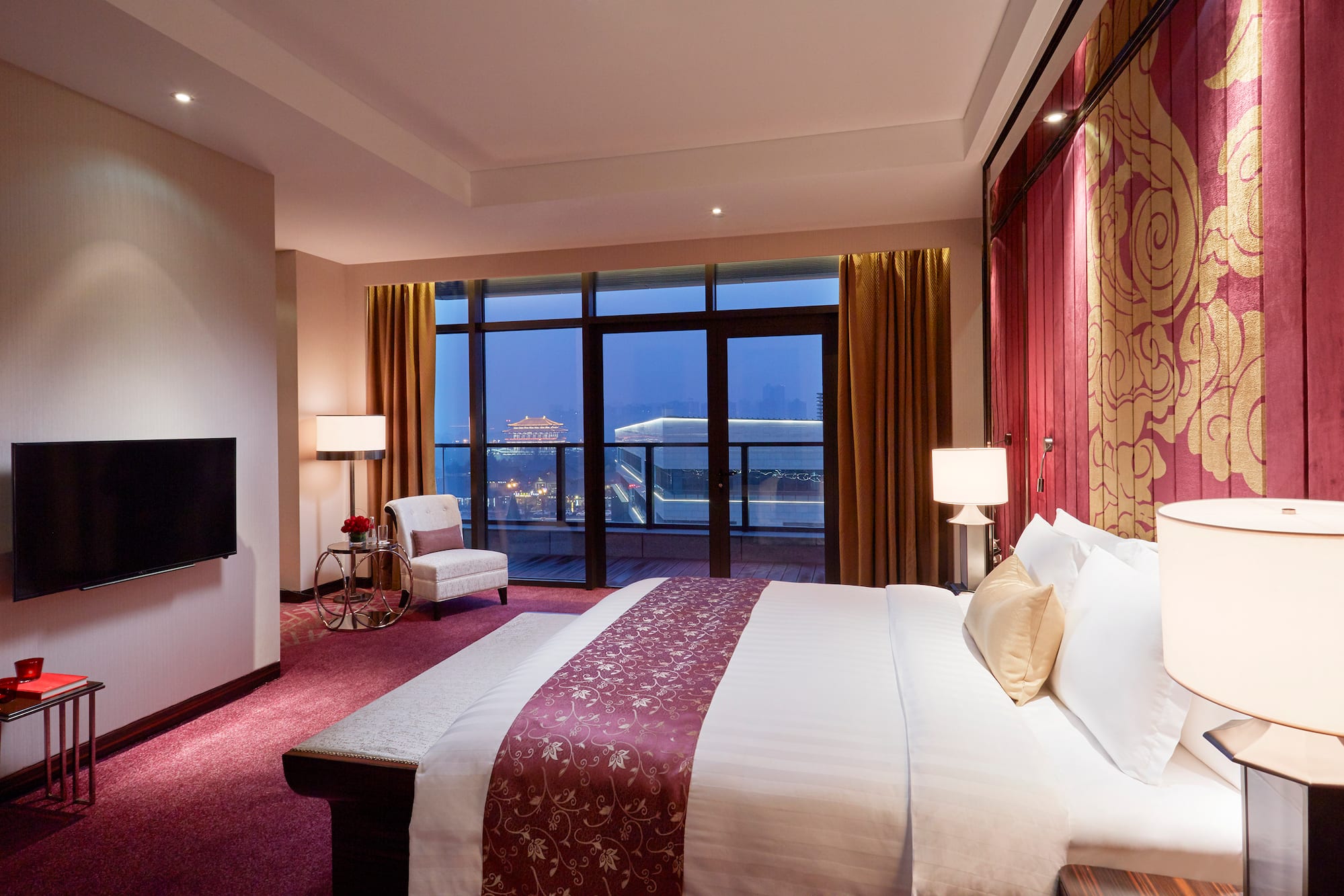 a room with a bed and a fireplace