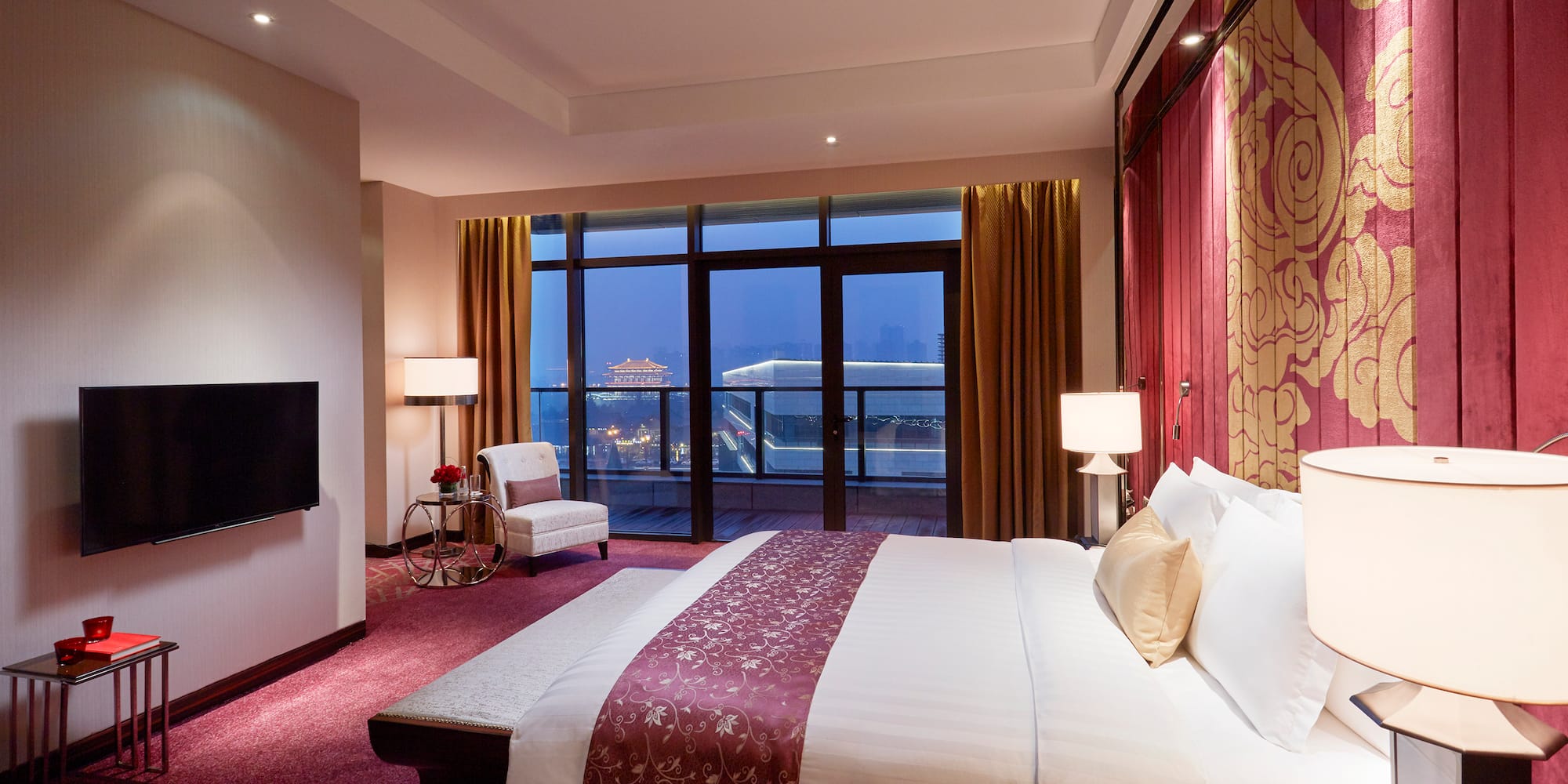 a room with a bed and a fireplace