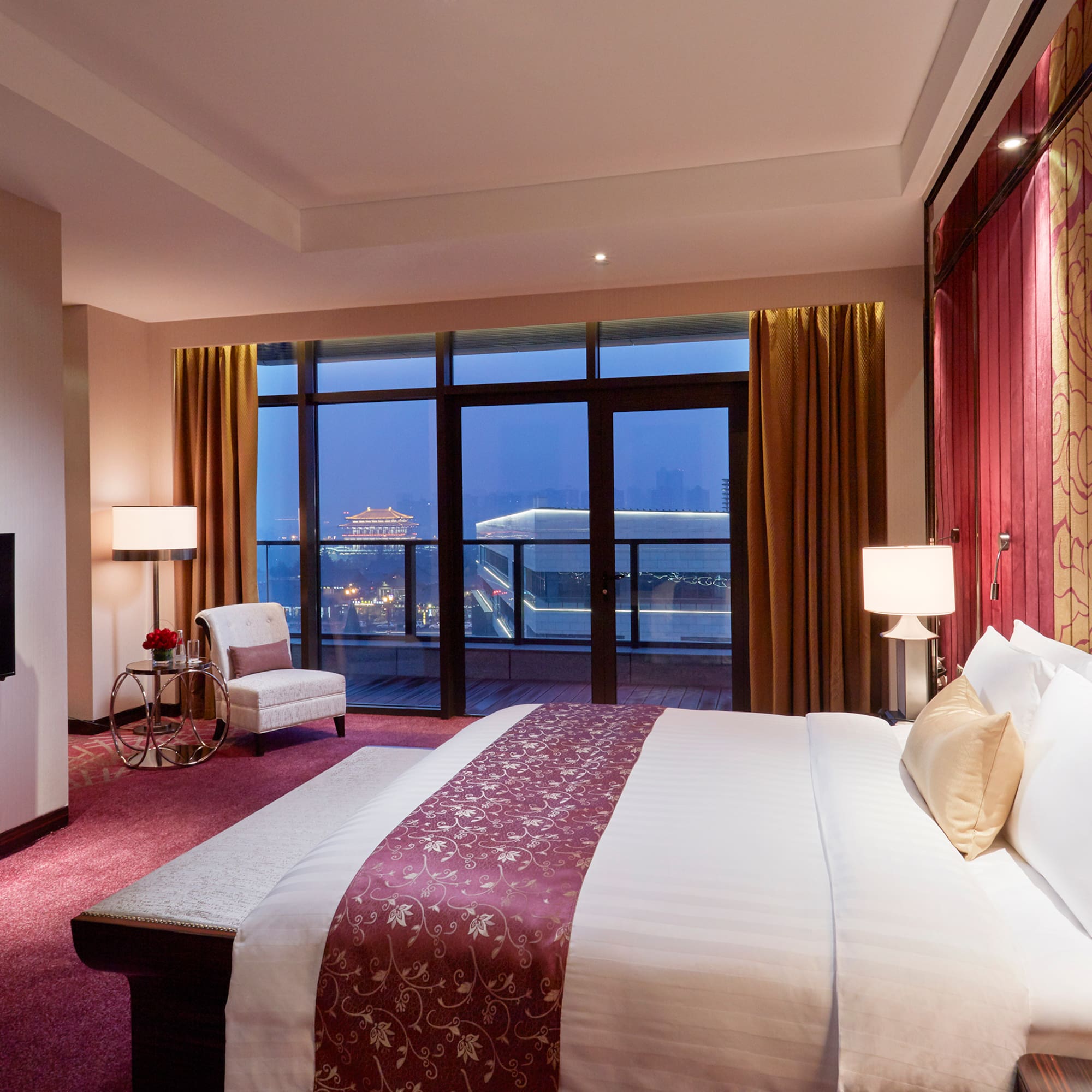 a room with a bed and a fireplace