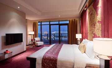 a room with a bed and a fireplace