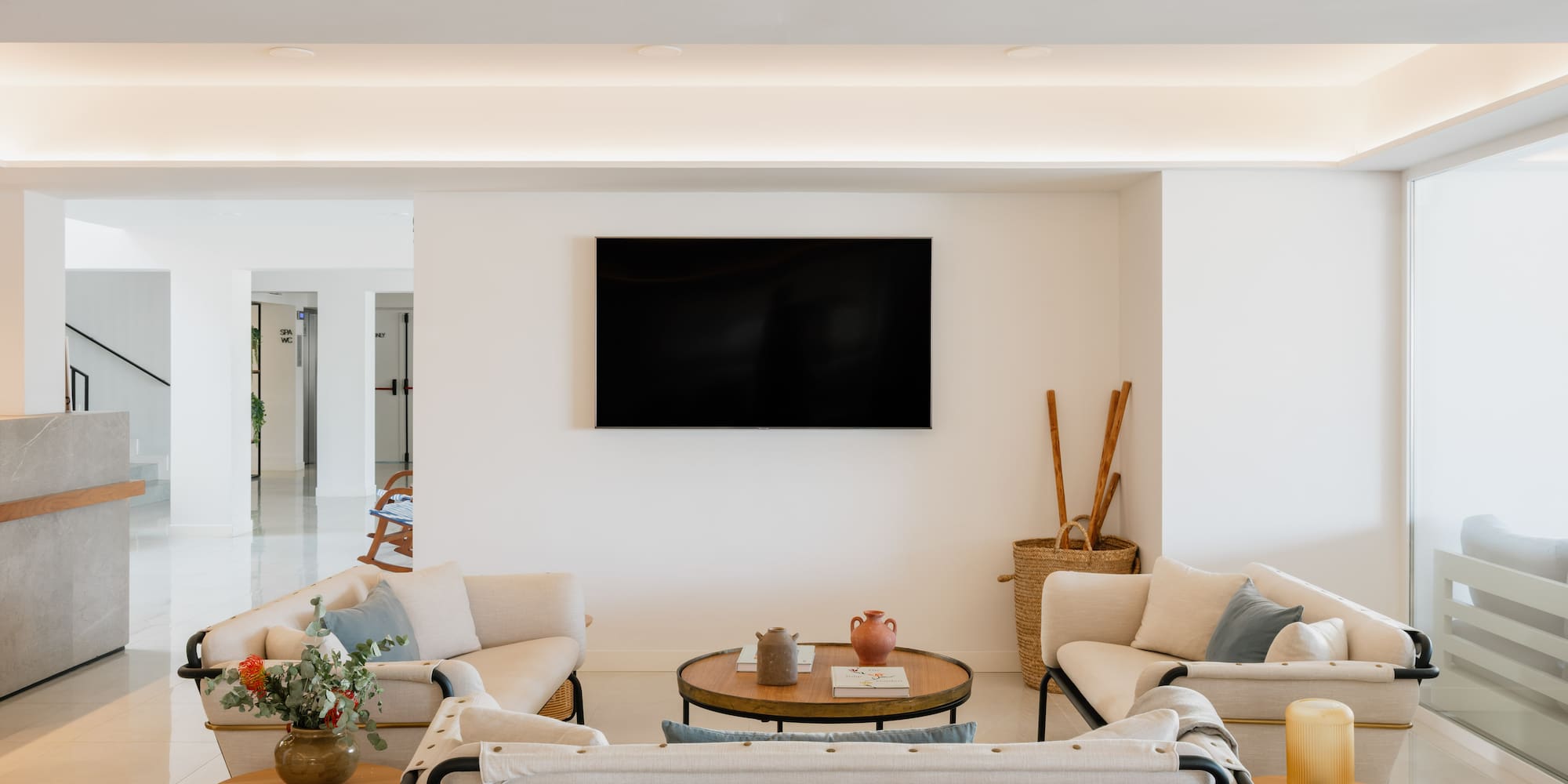 a room with a television on the wall