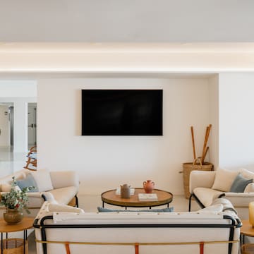 a room with a television on the wall