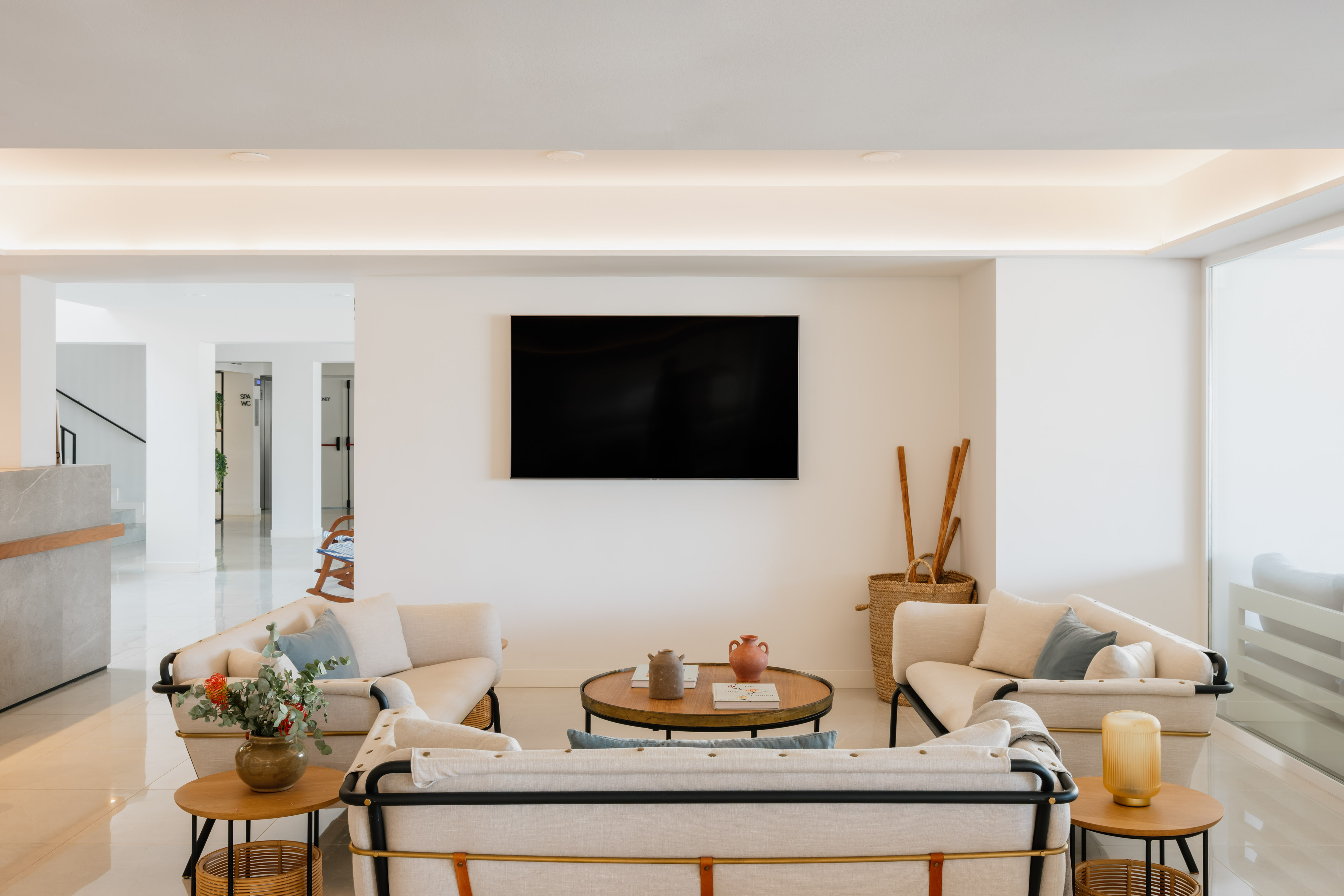 a room with a television on the wall