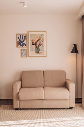 a couch and a lamp in a room