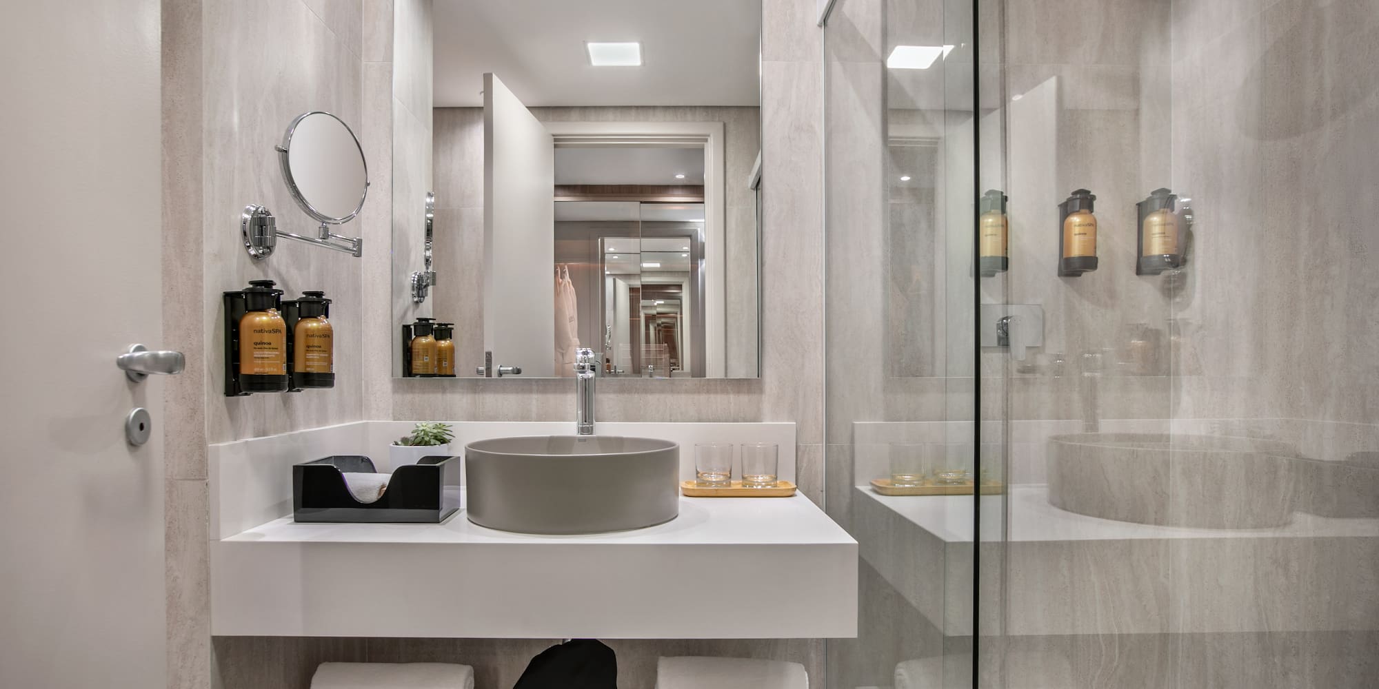 a bathroom with a shower and sink