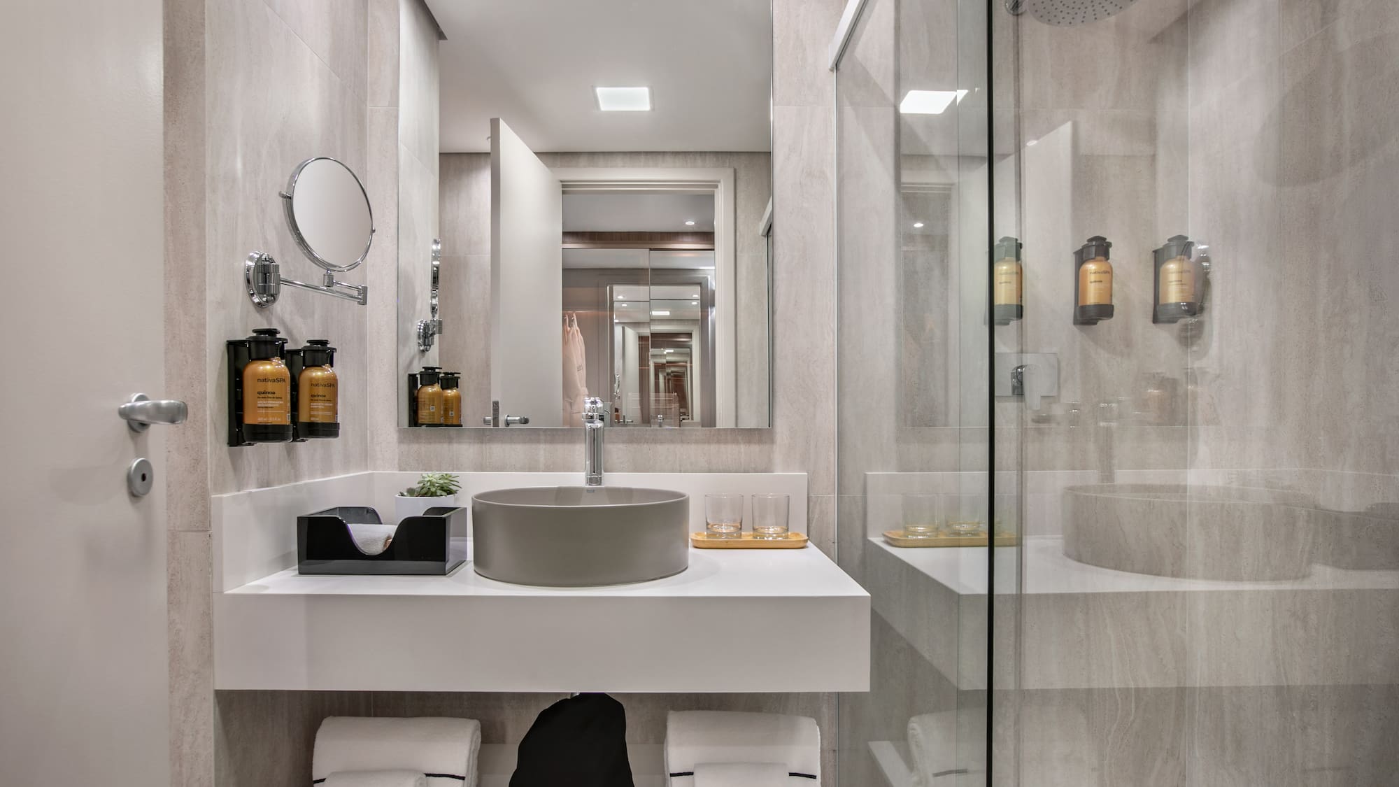 a bathroom with a shower and sink