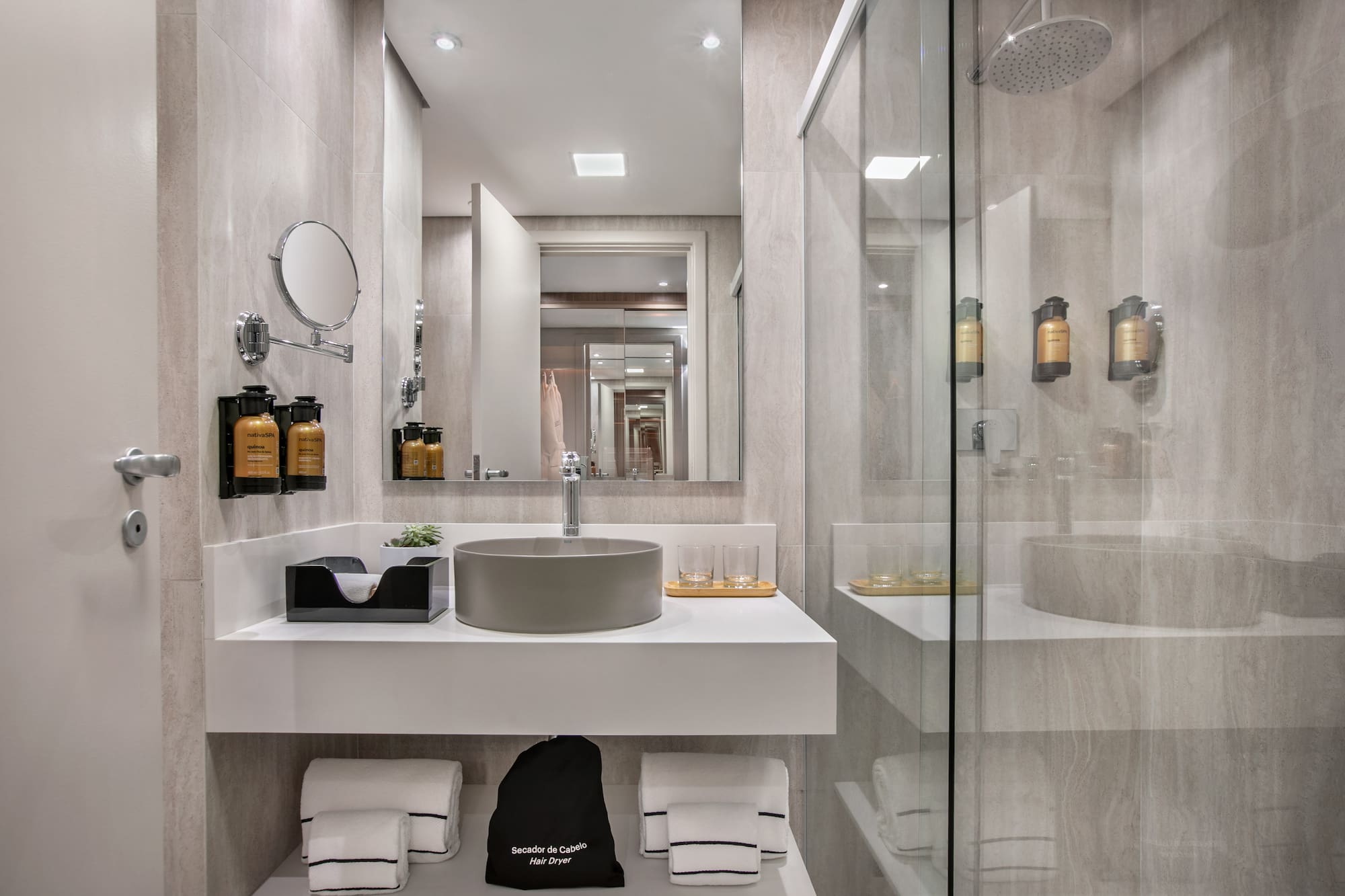 a bathroom with a shower and sink