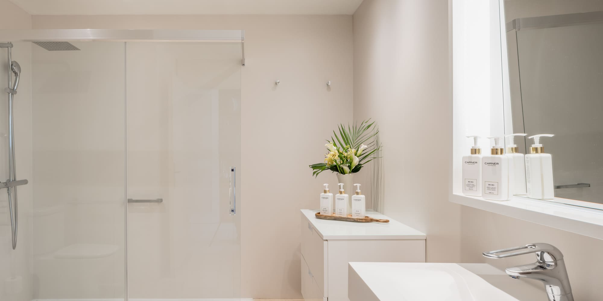 a bathroom with a shower and a sink