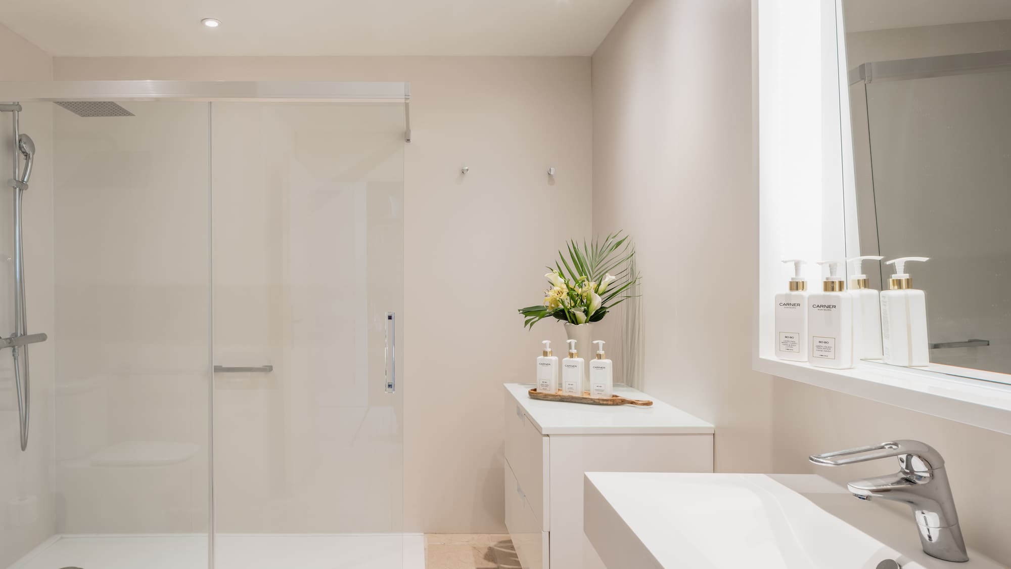 a bathroom with a shower and a sink