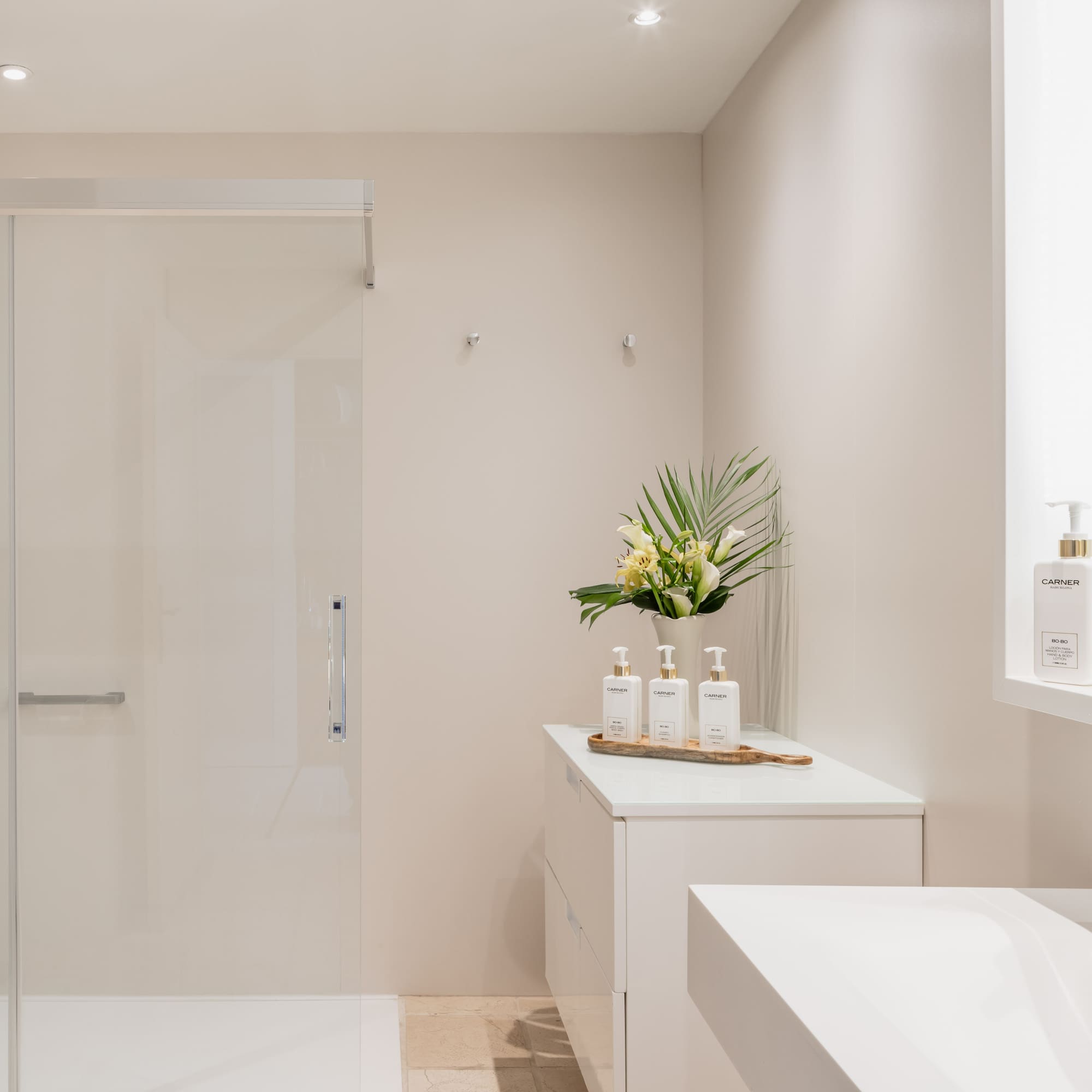 a bathroom with a shower and a sink