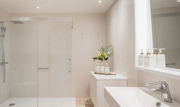 a bathroom with a shower and a sink