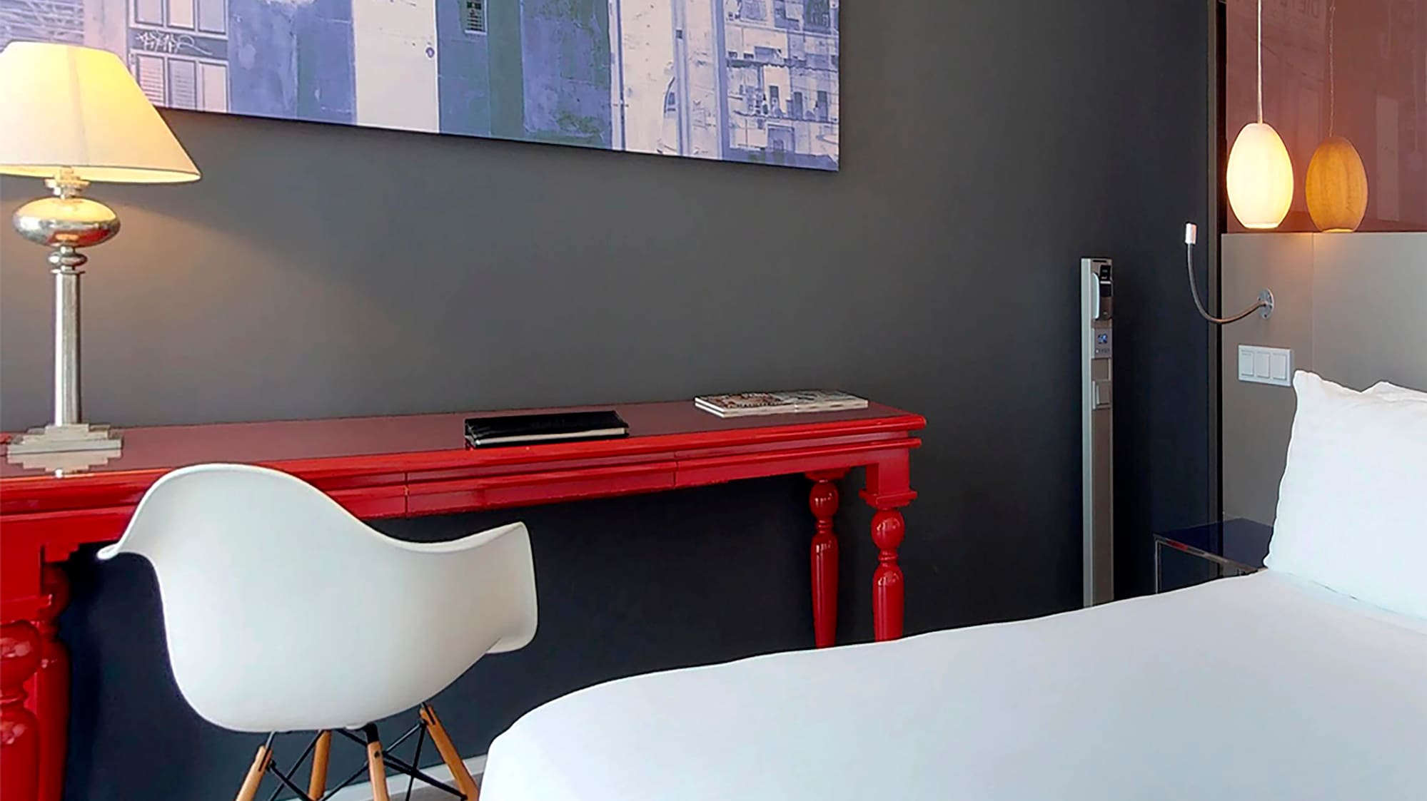a room with a red desk and a white chair