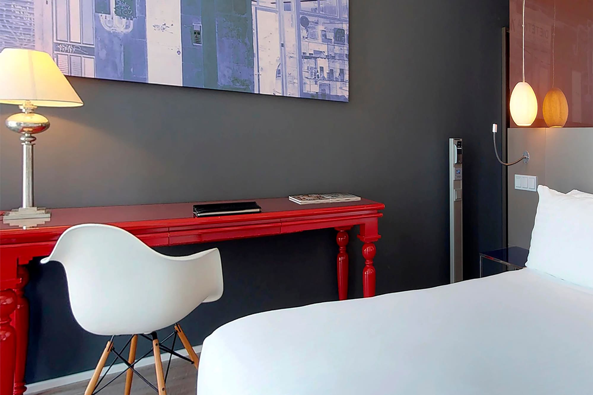 a room with a red desk and a white chair