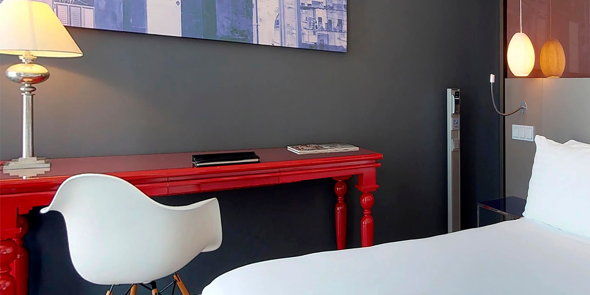 a room with a red desk and a white chair