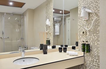 a bathroom with a mirror and sink