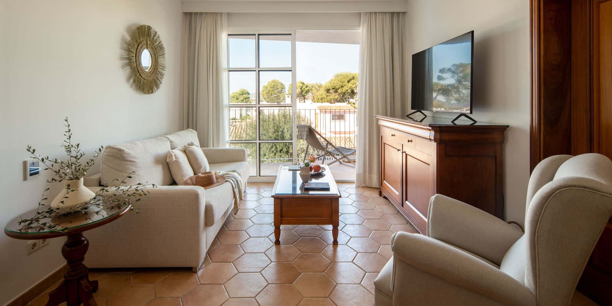 a living room with a television and a couch