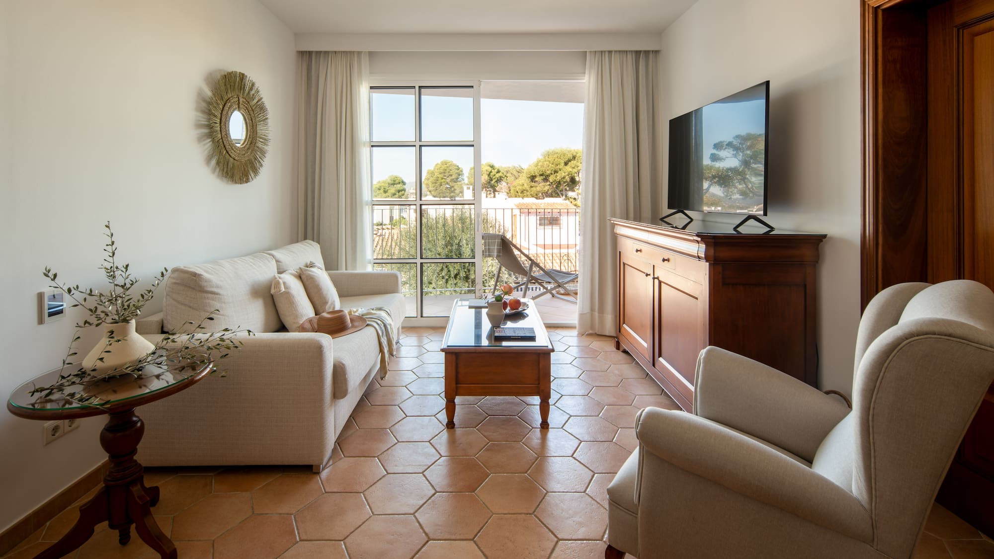 a living room with a television and a couch