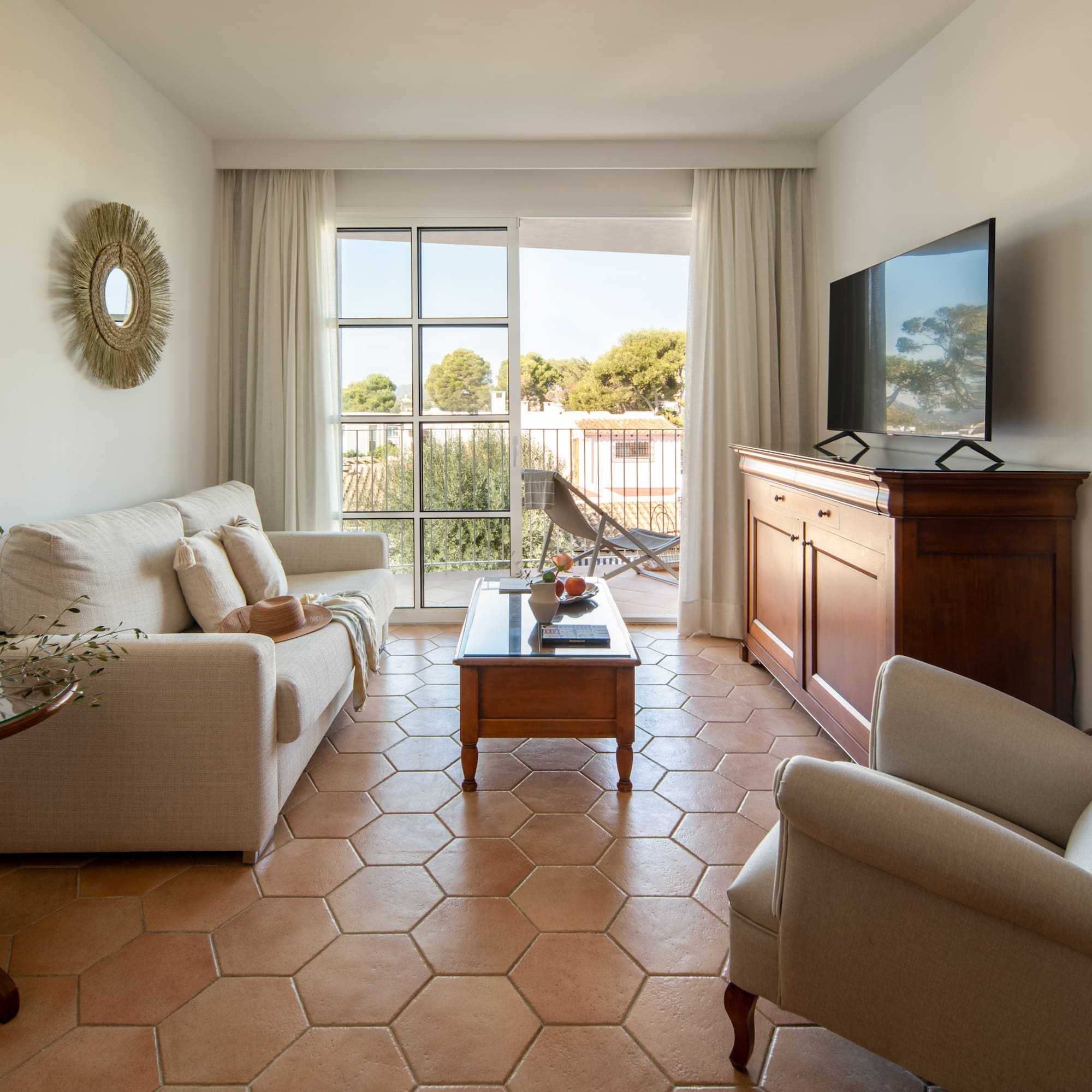 a living room with a television and a couch