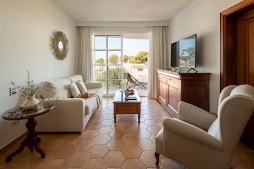 a living room with a television and a couch