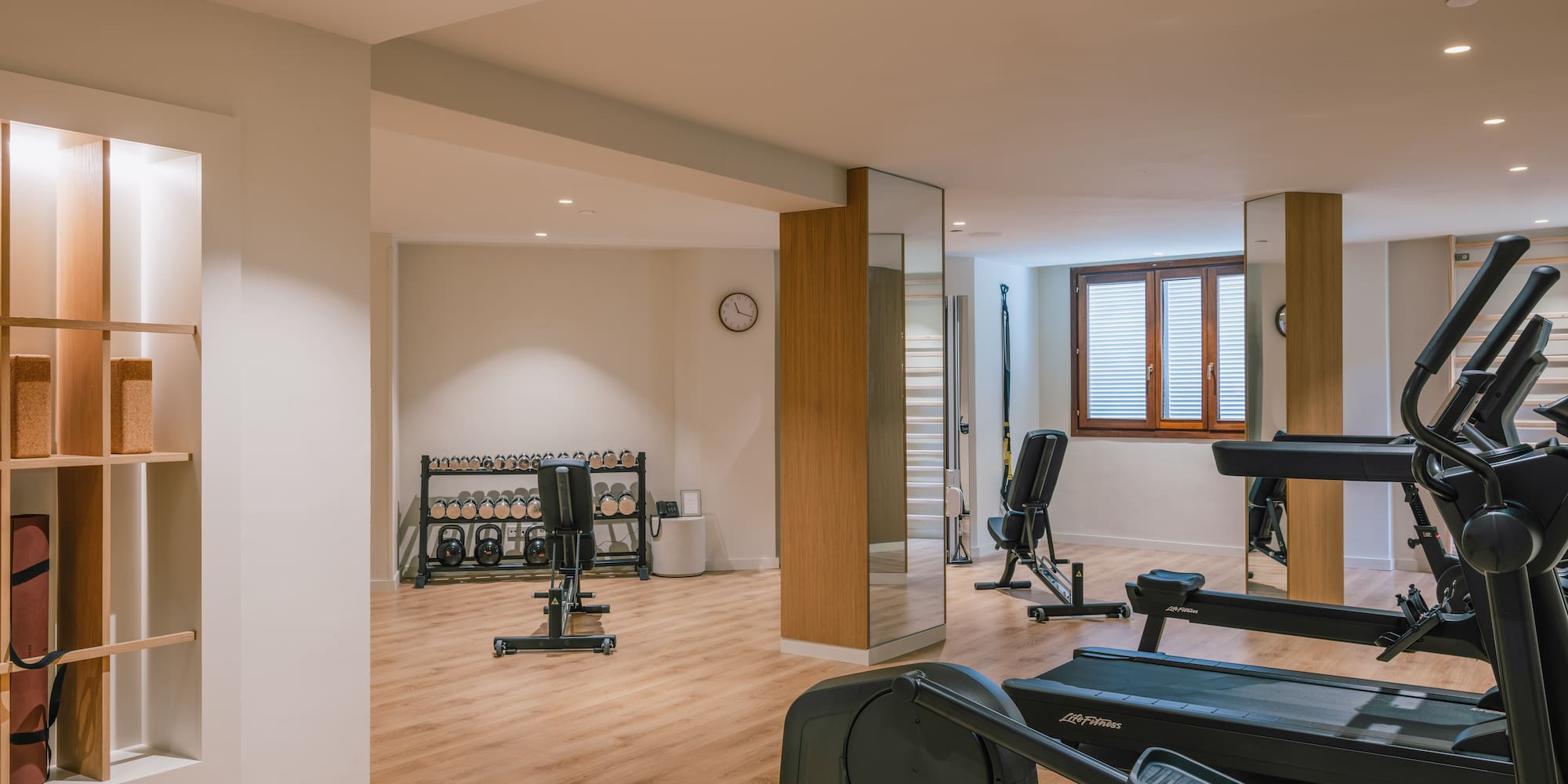 a room with treadmills and exercise equipment