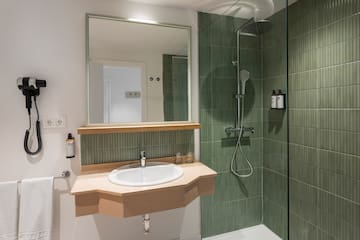 a bathroom with a sink and shower