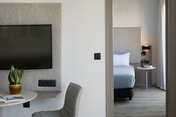 a room with a tv and a table