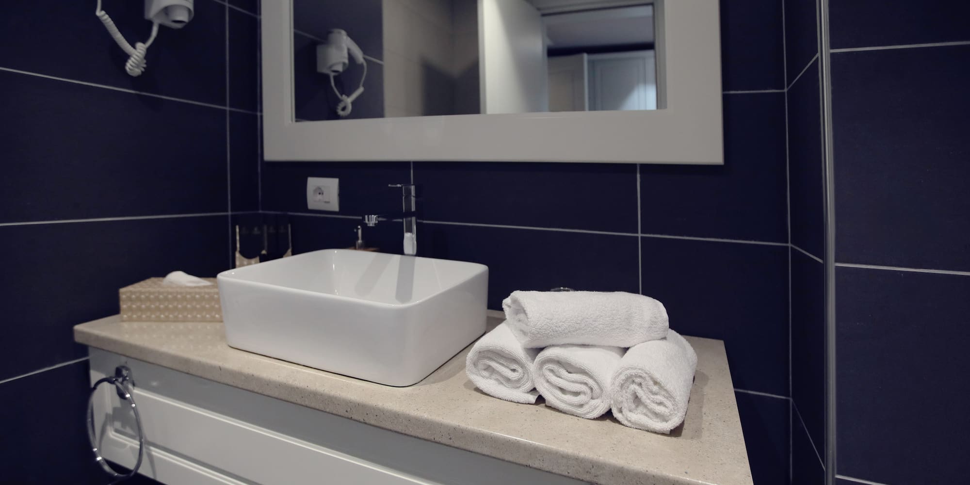 a sink and towels on a counter