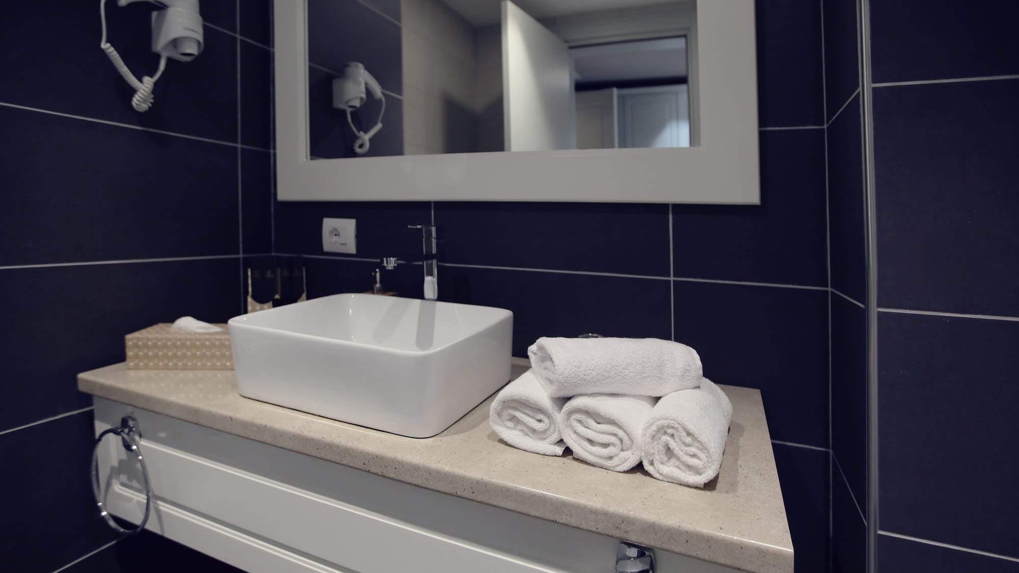 a sink and towels on a counter