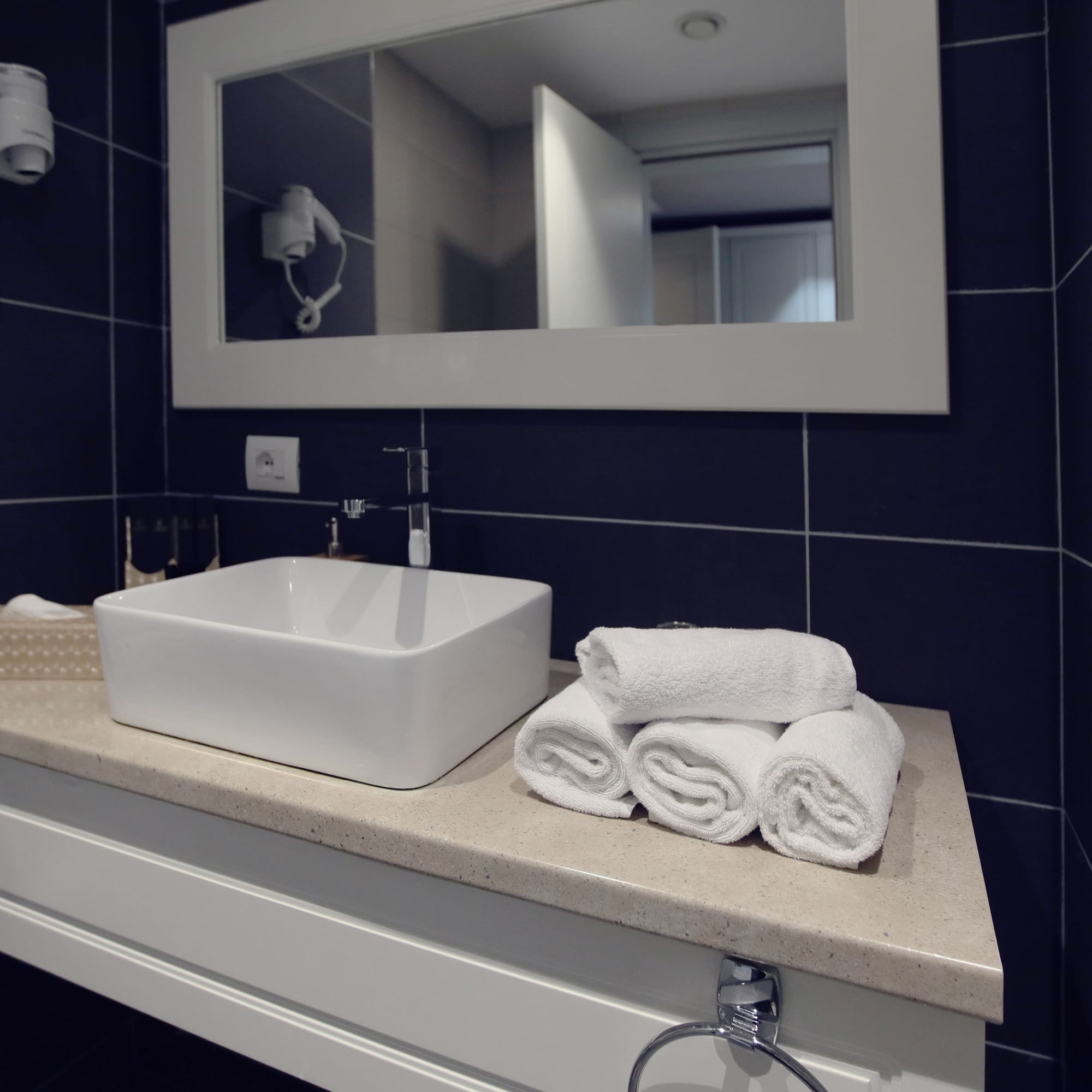 a sink and towels on a counter