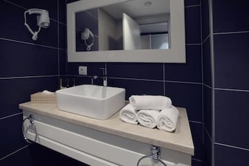 a sink and towels on a counter