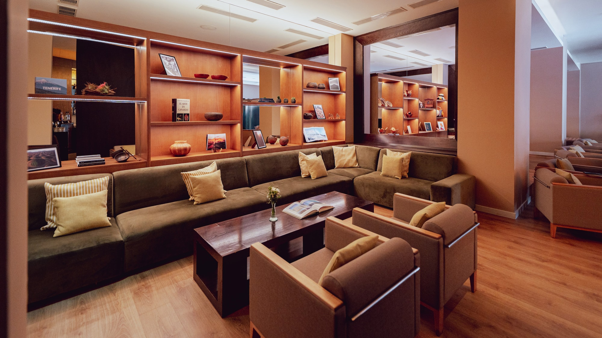 a room with a couch and chairs