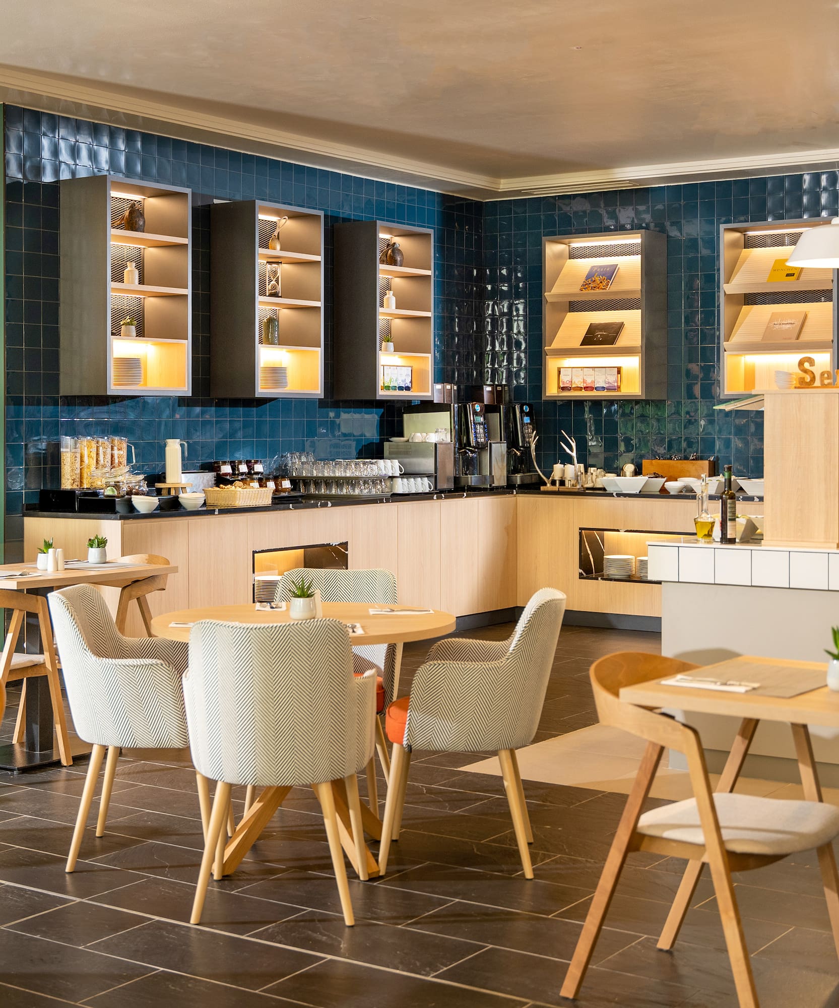 a room with blue walls and tables and chairs
