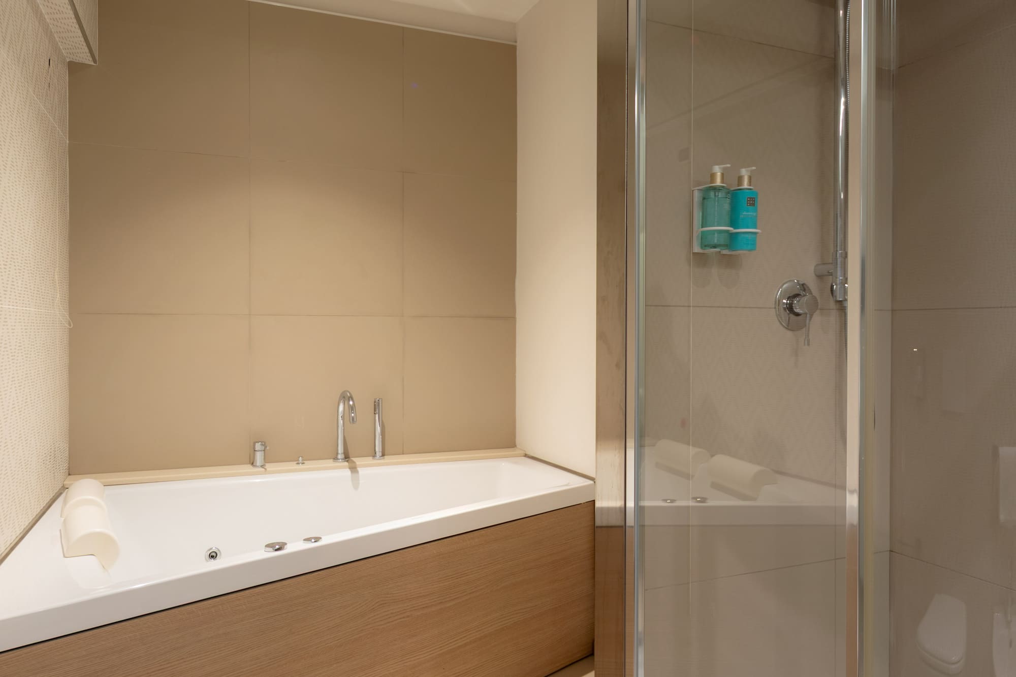 a bathroom with a bathtub and shower