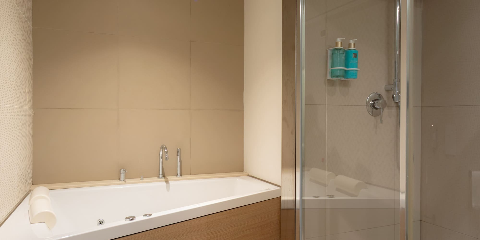 a bathroom with a bathtub and shower