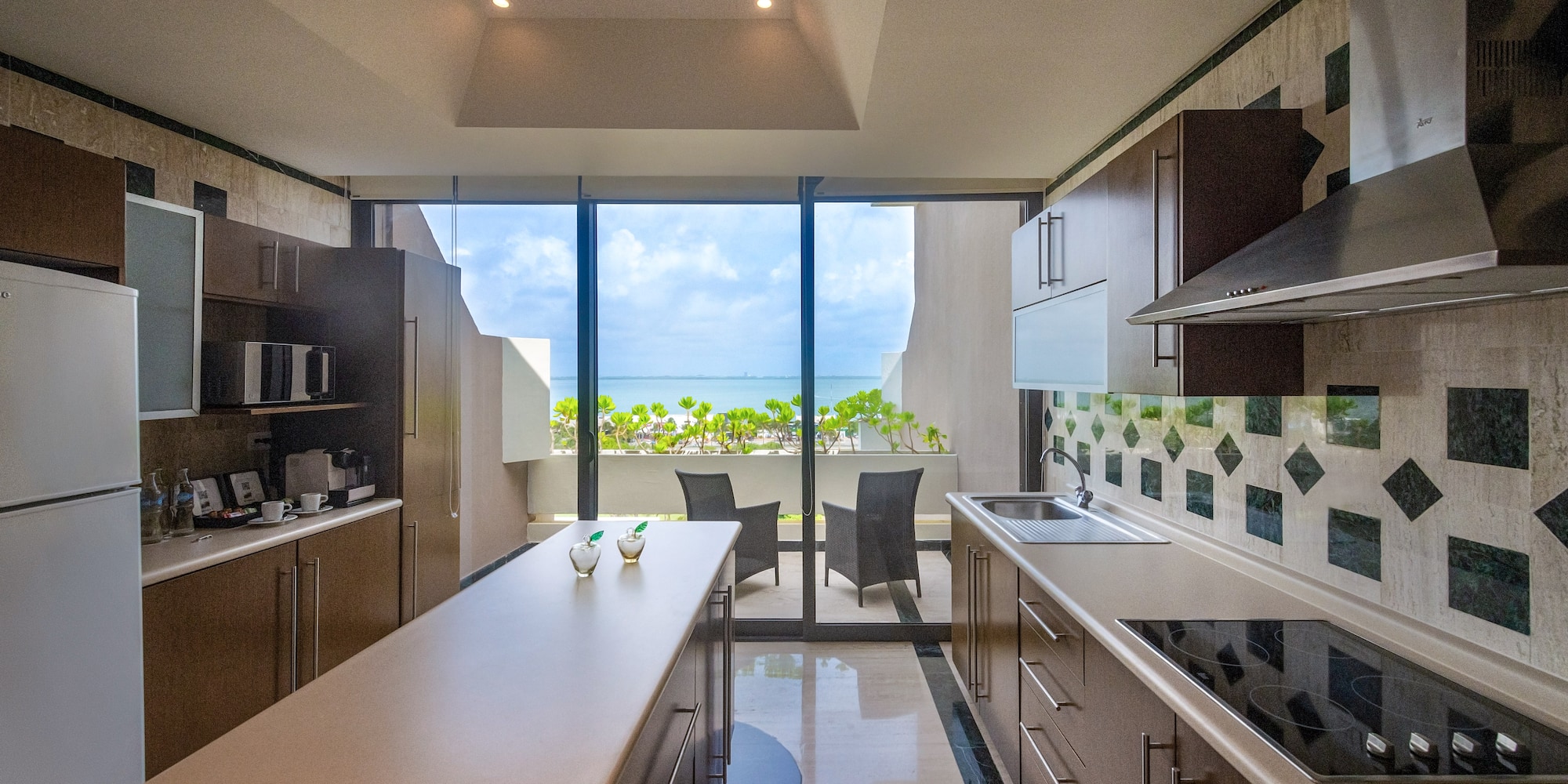 a kitchen with a large glass door