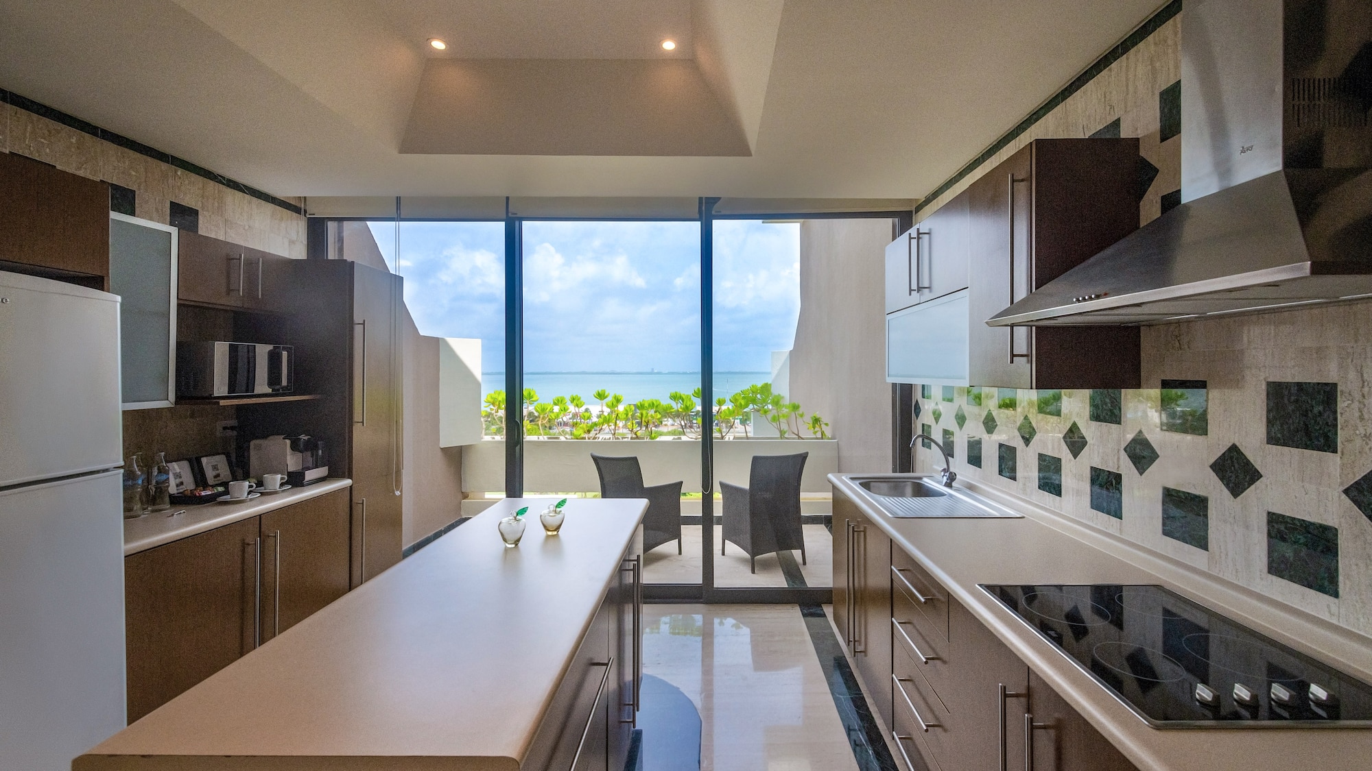 a kitchen with a large glass door