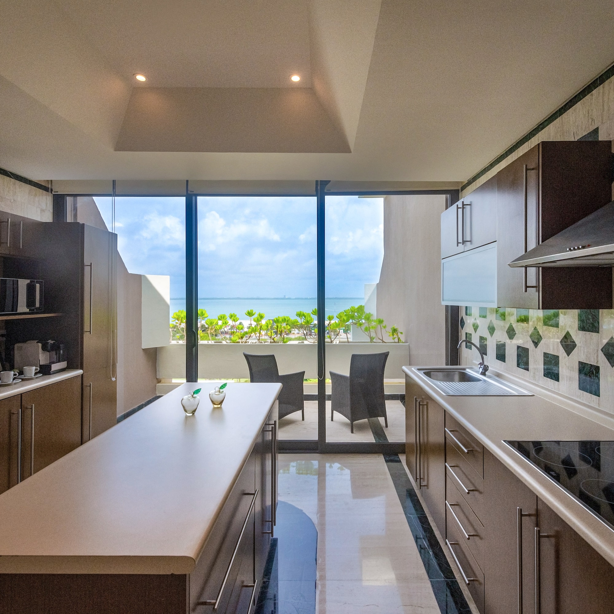 a kitchen with a large glass door