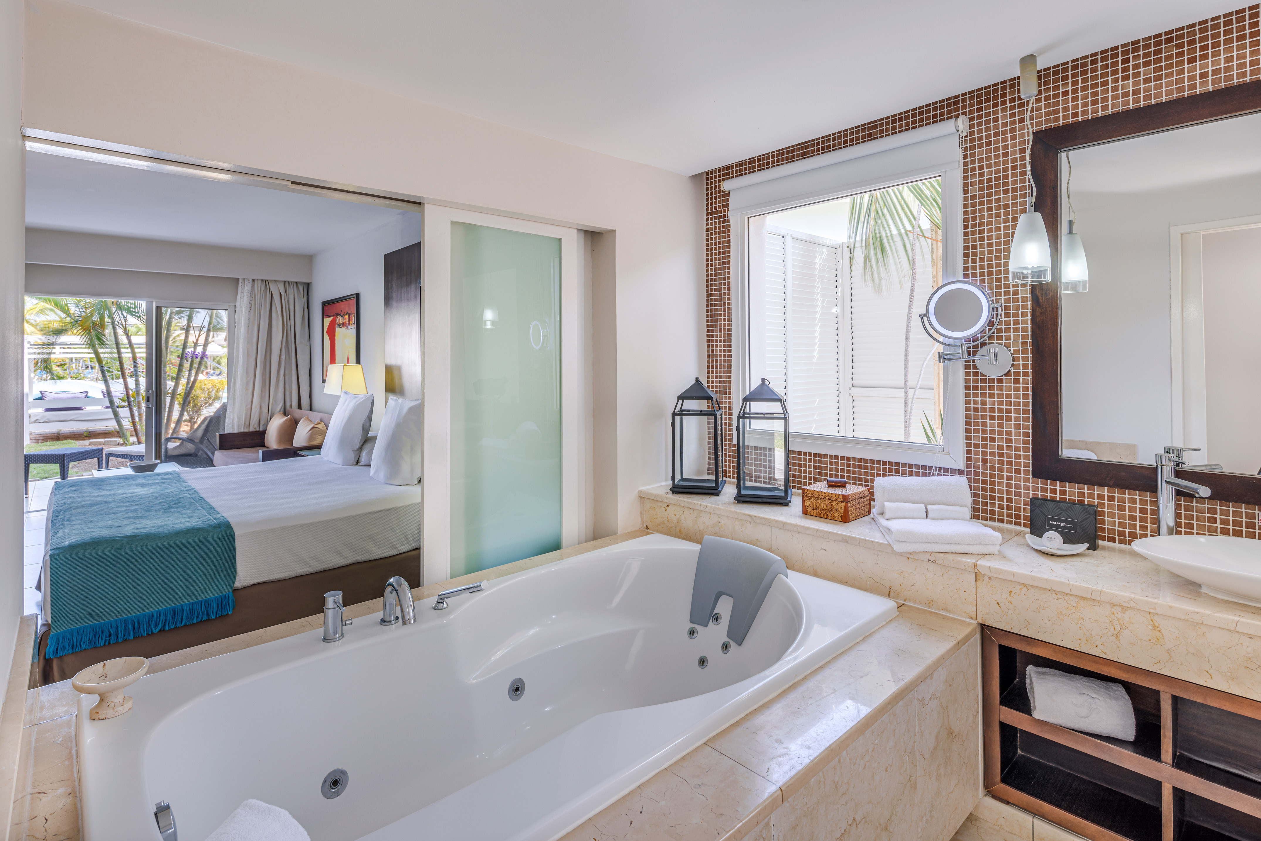 a bathroom with a bathtub and a mirror