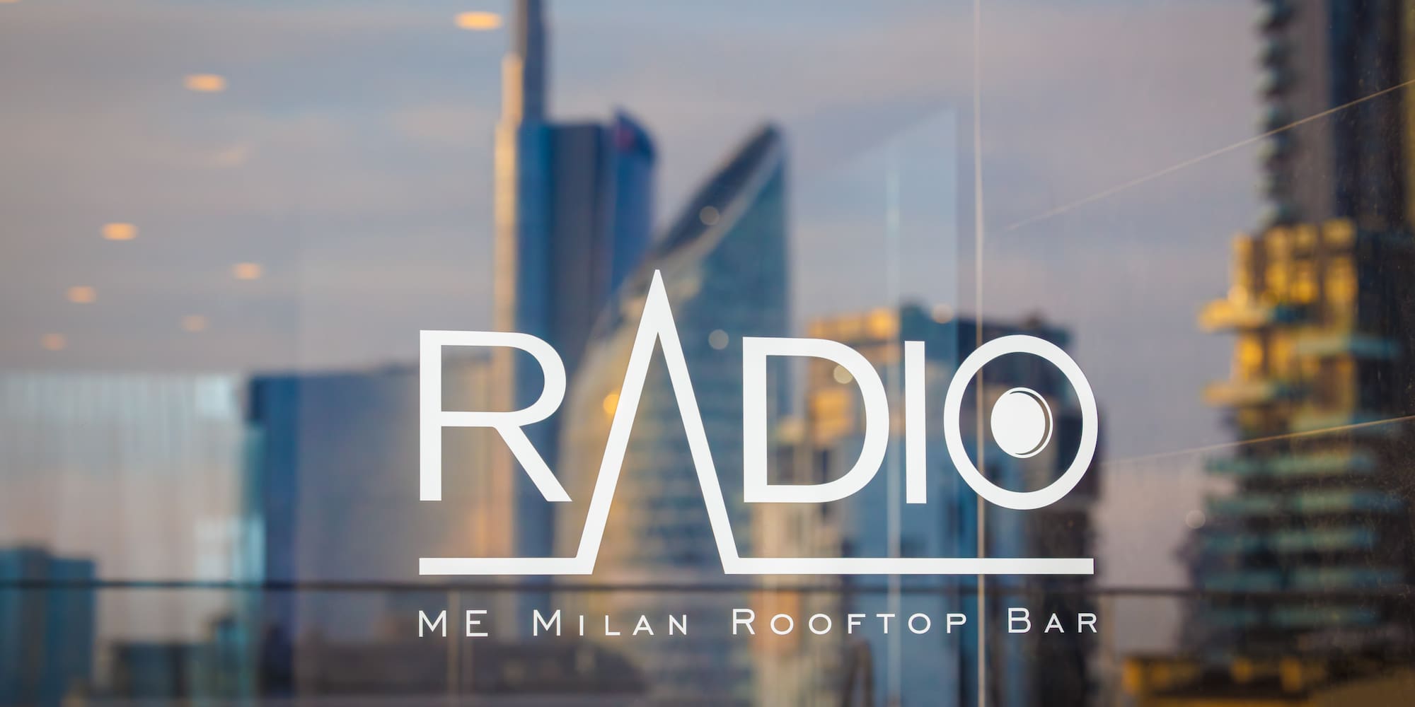 a glass window with a building in the background