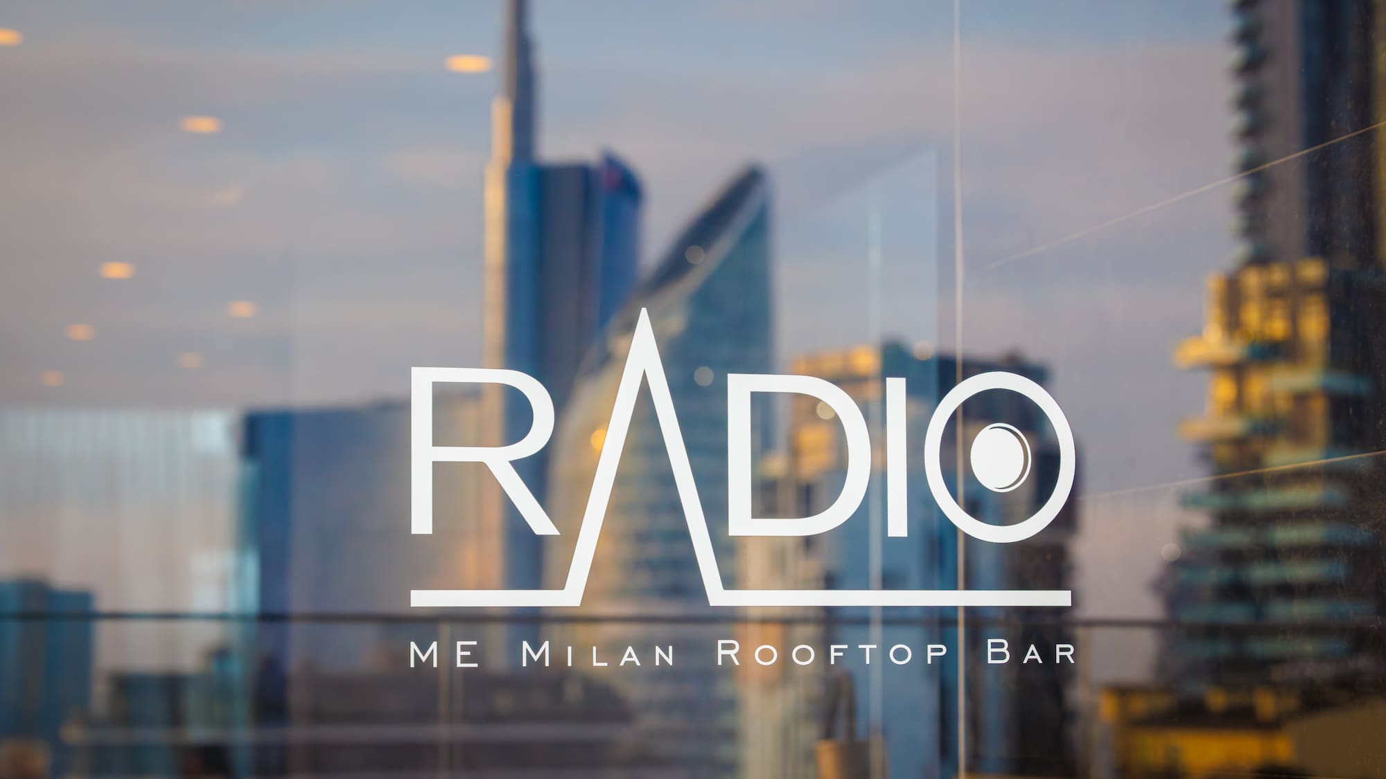 a glass window with a building in the background