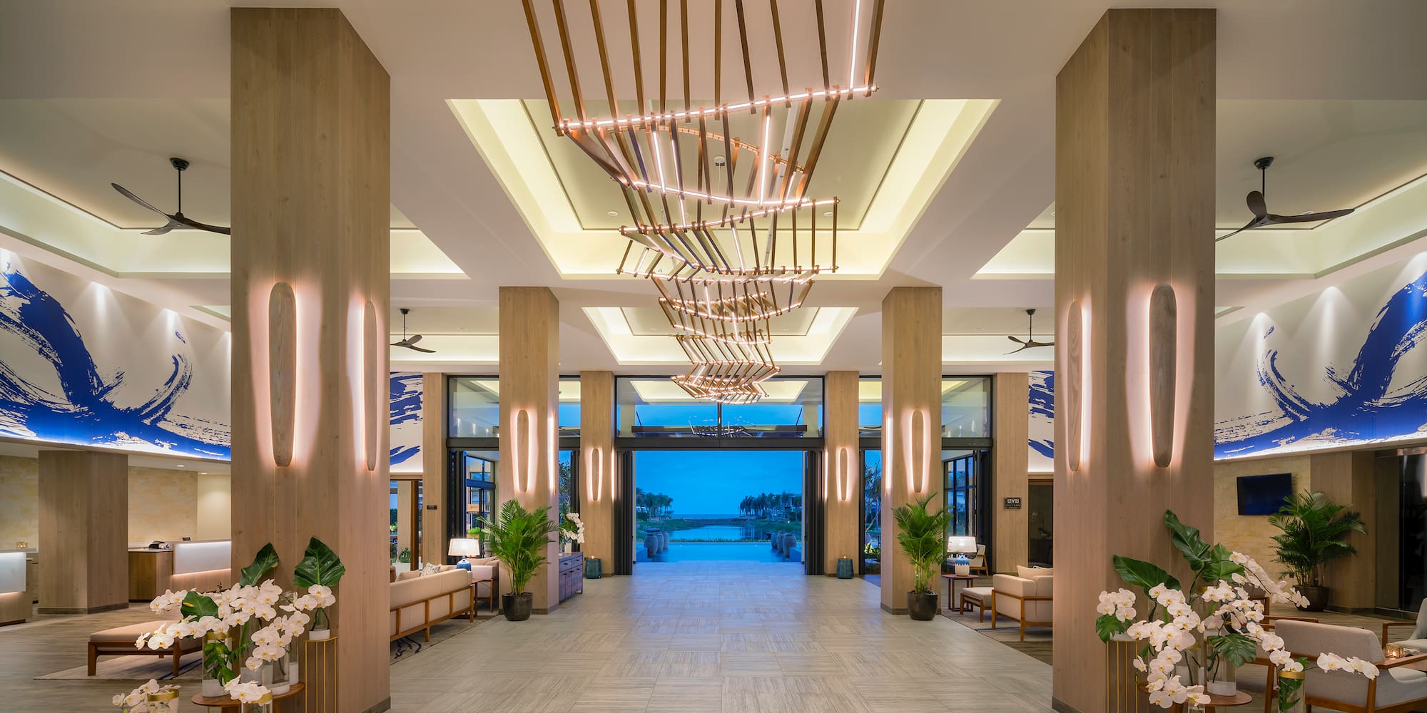 a large hallway with lights and flowers