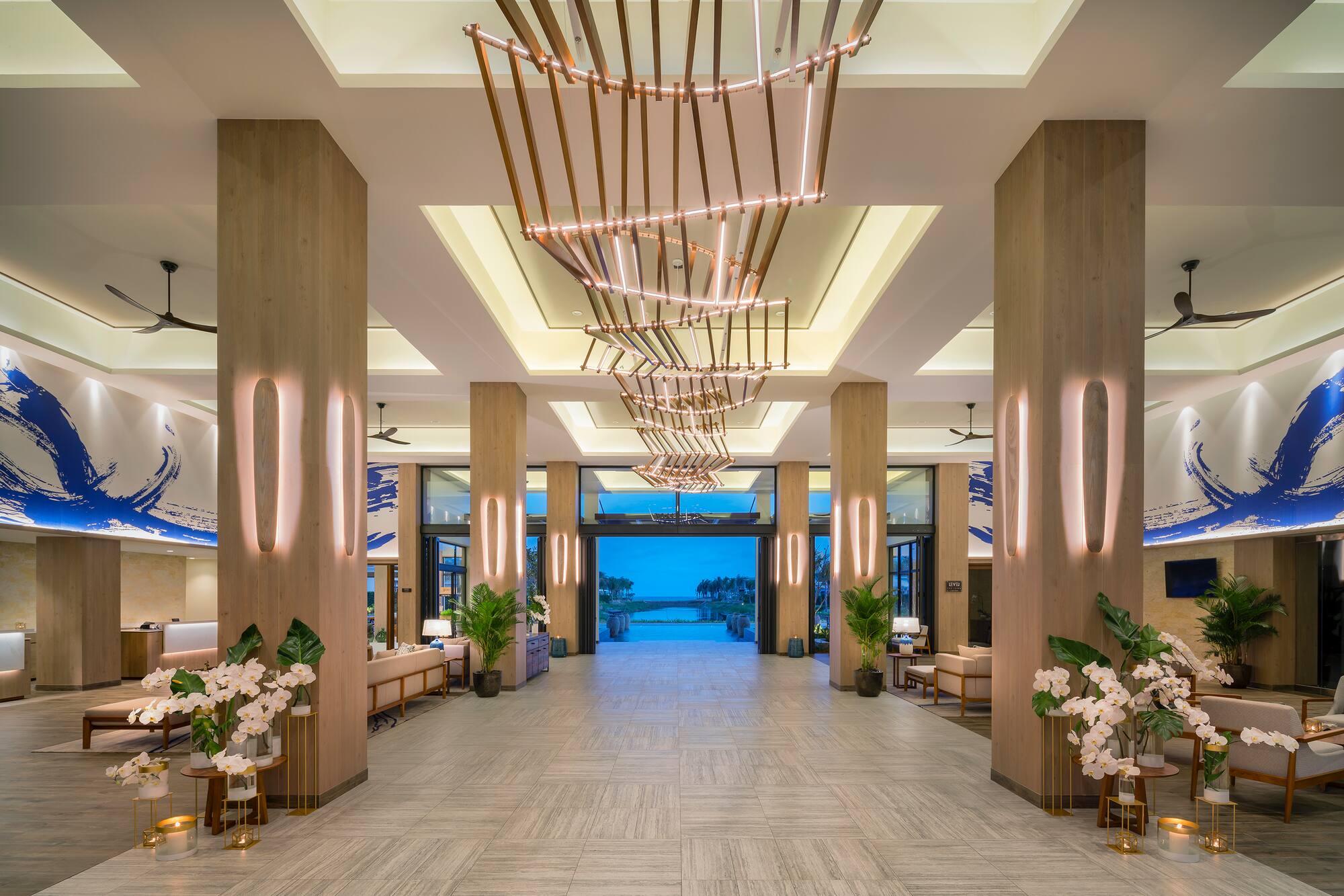 a large hallway with lights and flowers