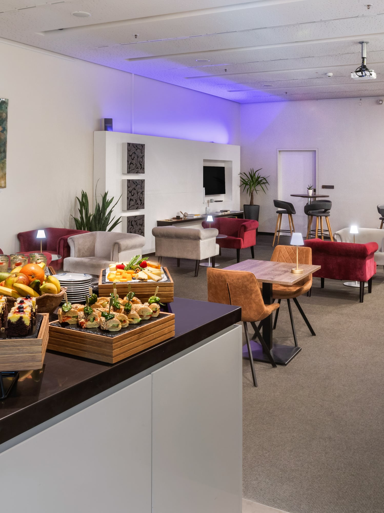 a room with a table and chairs and tables and chairs