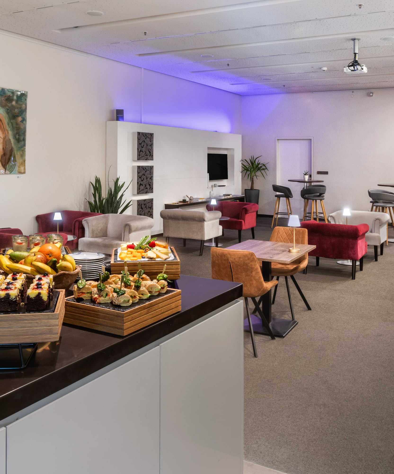 a room with a table and chairs and tables and chairs