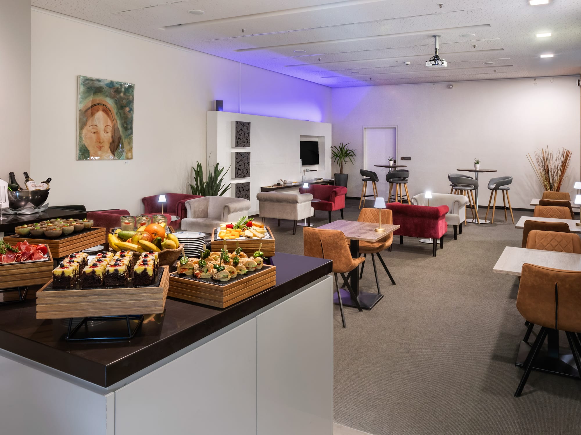 a room with a table and chairs and tables and chairs