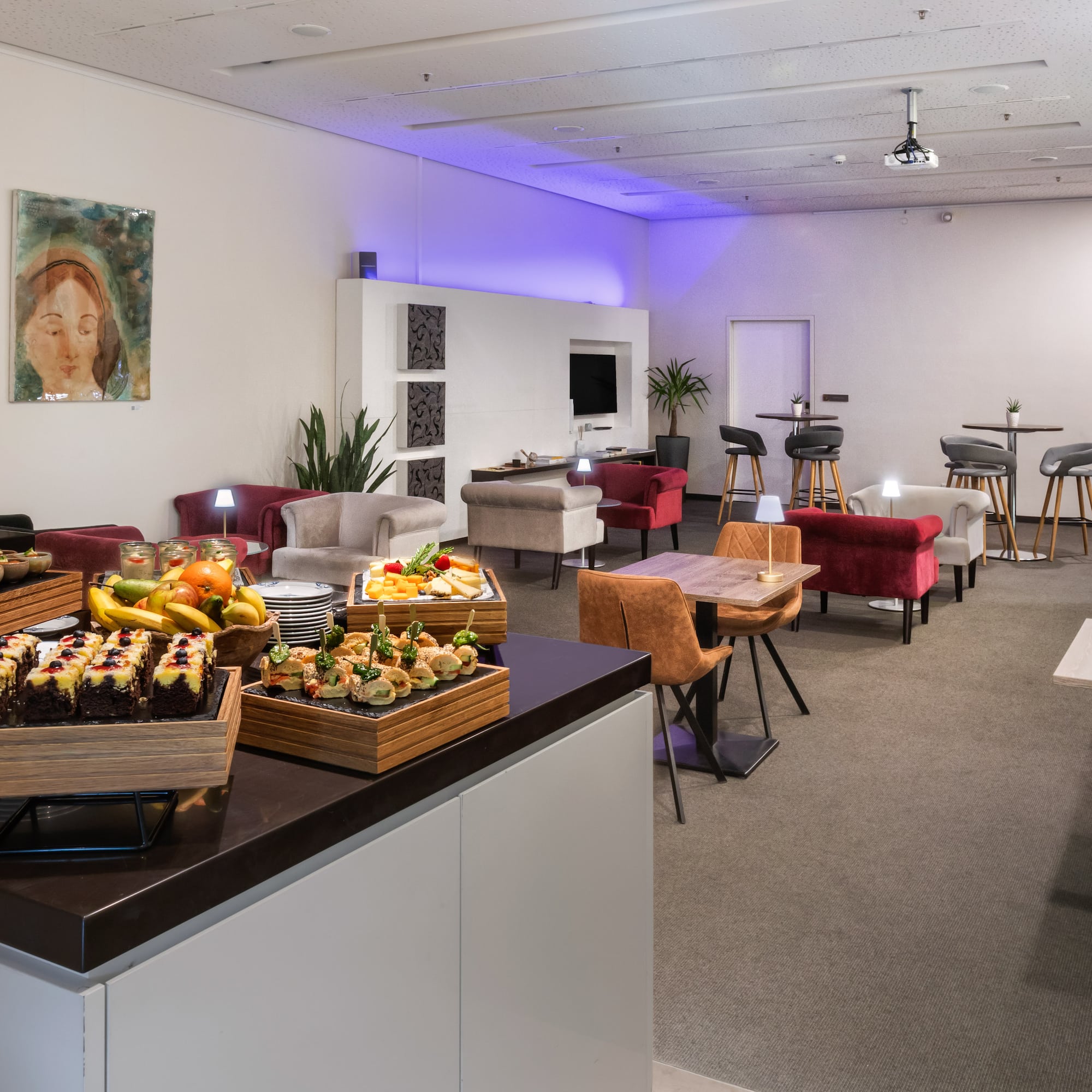 a room with a table and chairs and tables and chairs