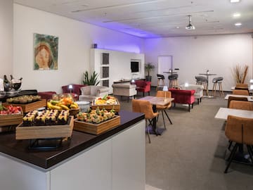 a room with a table and chairs and tables and chairs