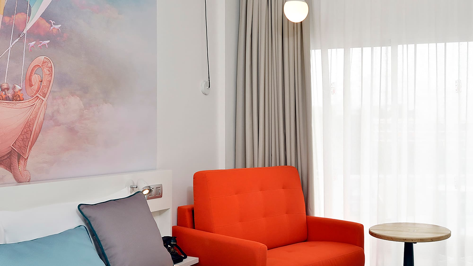 a room with a bed and chair